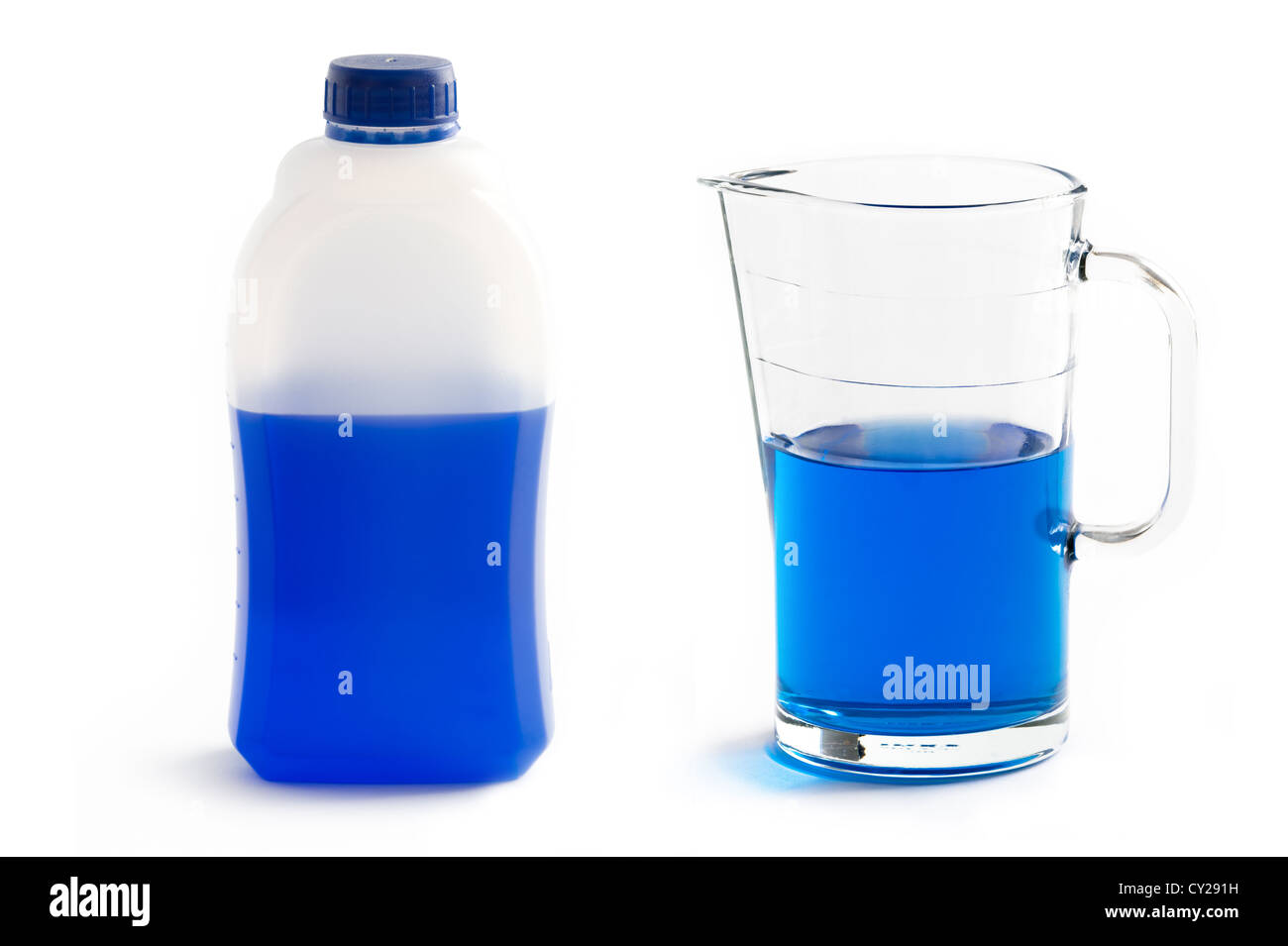 concentrated liquid screen wash or screenwash in plastic bottle and diluted in jug isolated Stock Photo