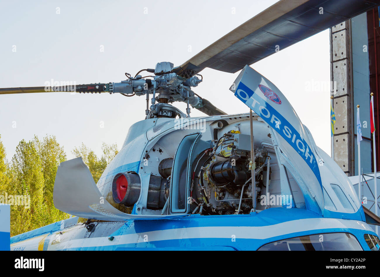 Upgraded Mi-2MSB ( MSB-2) helicopter. Front view of open covers of an turbine compartment of the helicopter. Stock Photo