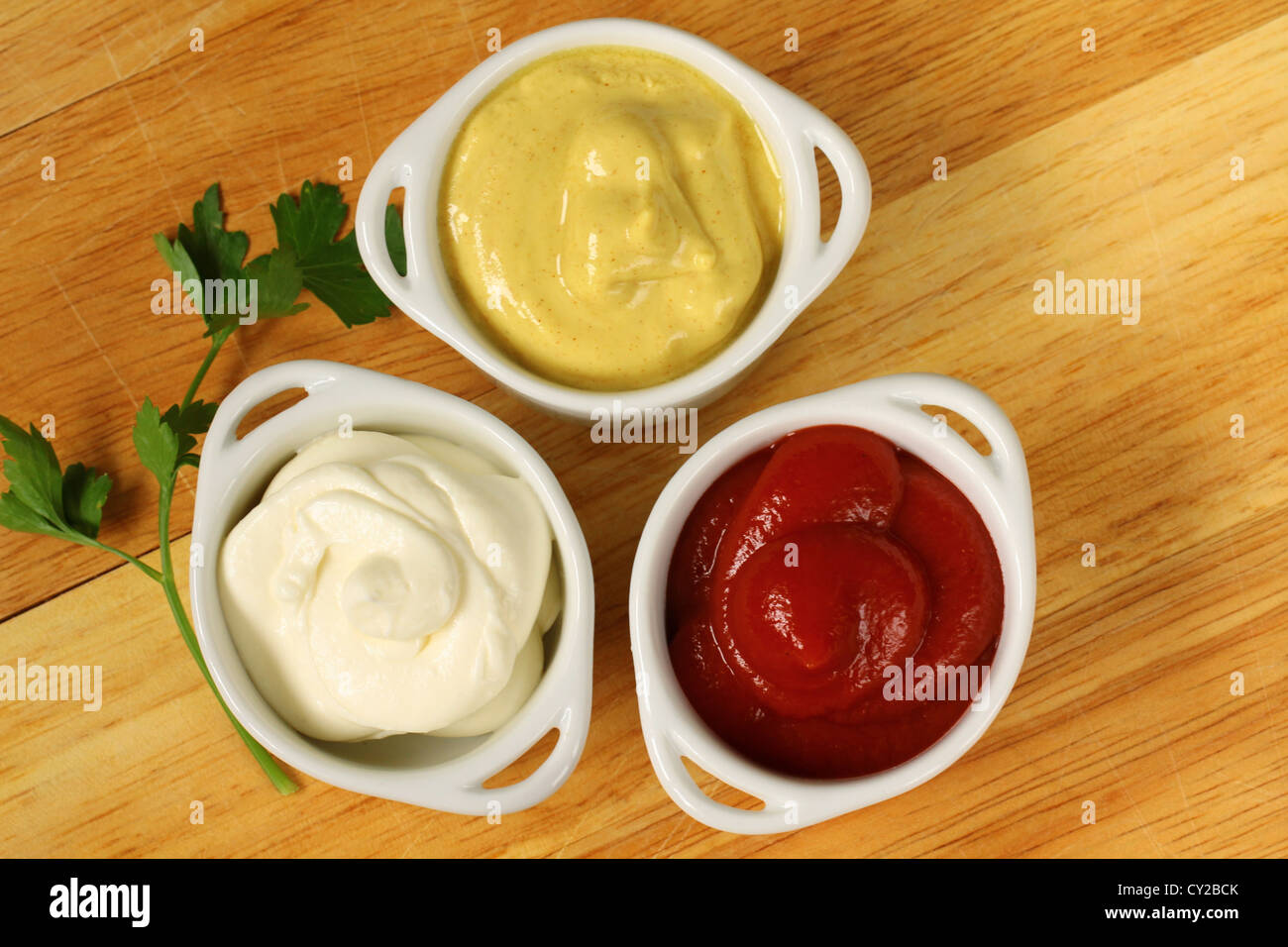 three kinds of sauces, mustard, ketchup and mayonnaise Stock Photo Alamy