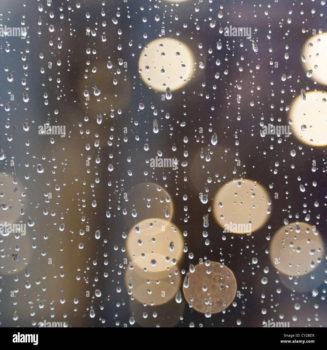 Drops of rain on window and abstract lights Stock Photo - Alamy