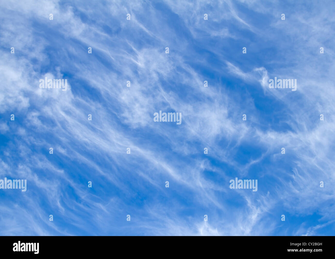 Wispy white clouds on a blue sky Stock Photo