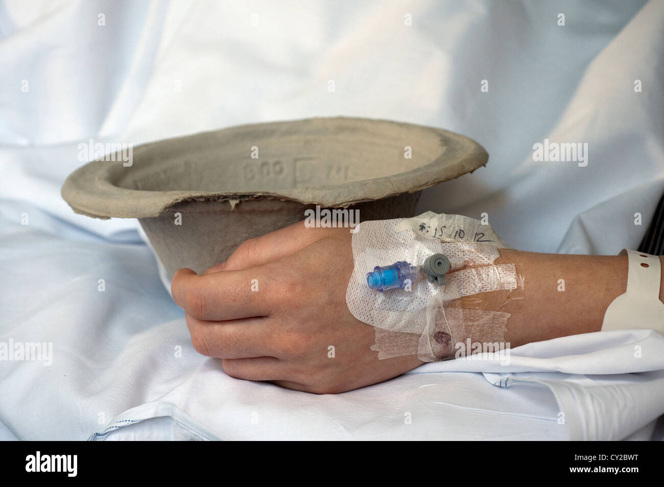 Hospital sick bowl and drip with cannula (from Latin 'little reed'; plural cannulae) or canula,sick bed,ill Stock Photo