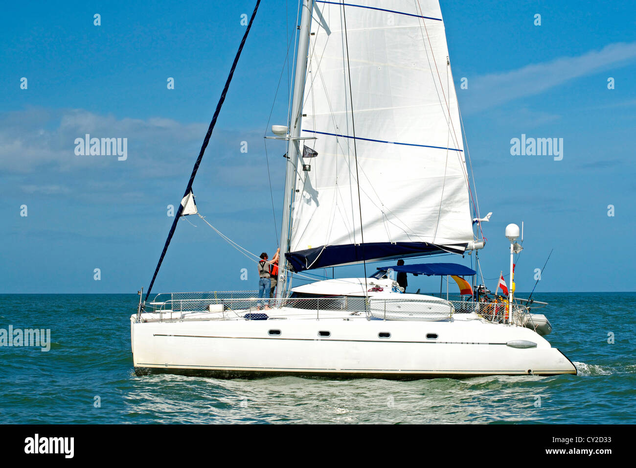Luxury white catamaran boat in the ocean with blue sky Stock Photo - Alamy