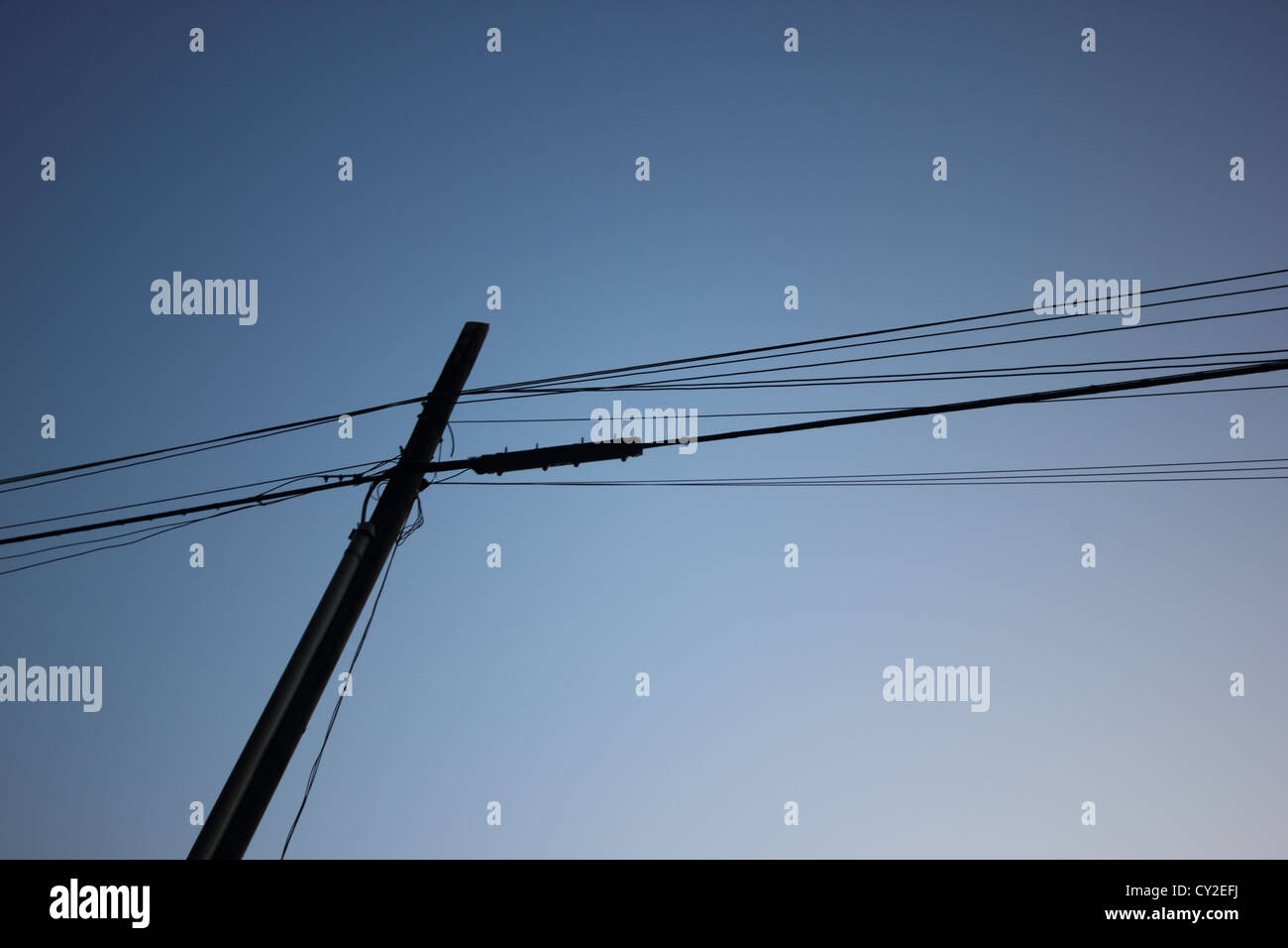 telephone pole with wires against a clear blue sky, electricity, communications, simple, clear, photoarkive Stock Photo