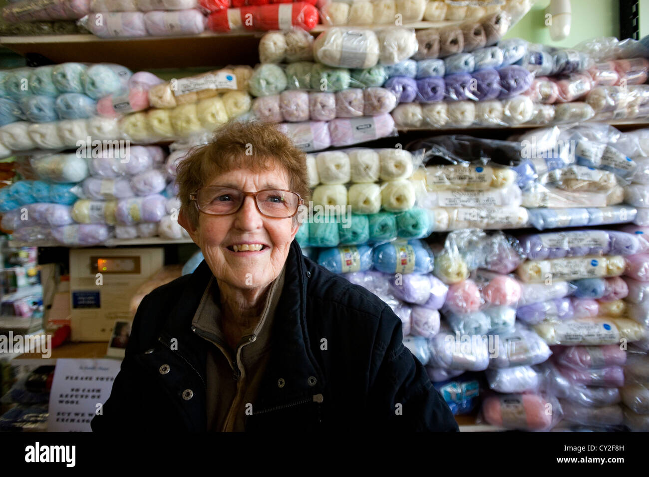 older woman in wool shop Stock Photo
