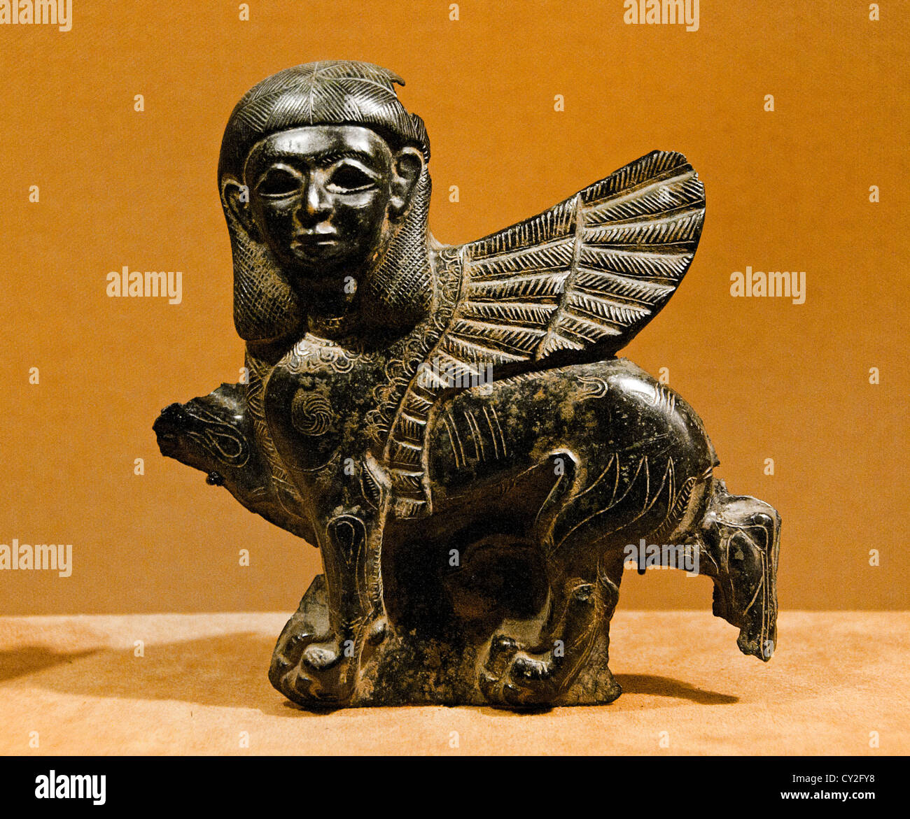 Plaque in the form of a sphinx Iron Age II  8th century B.C. Syria 12.4 cm Syrian bronze Stock Photo