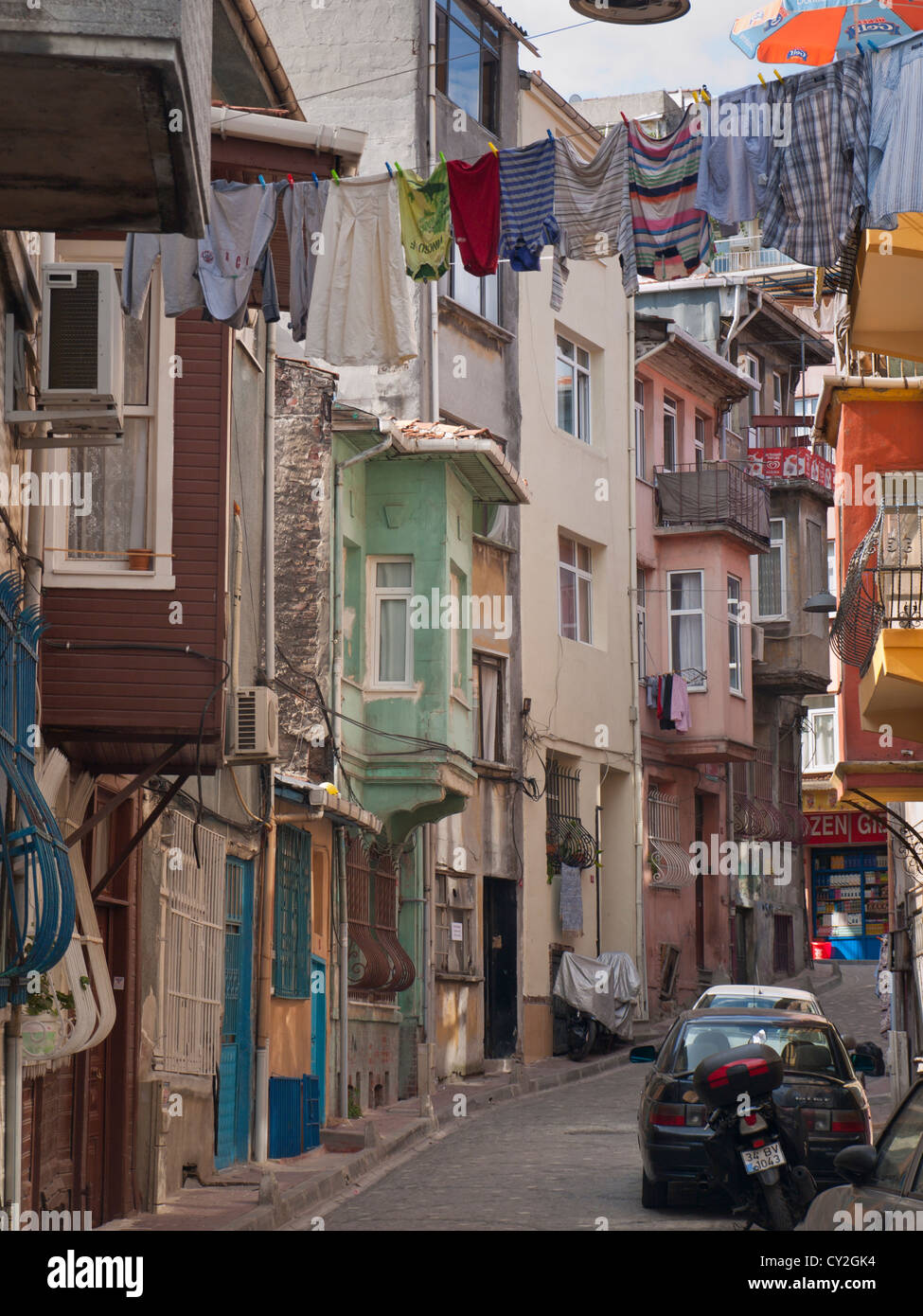Clothes line, washing and  old houses in traditional Turkish style in a street in  the Balat district of Istanbul Turkey Stock Photo