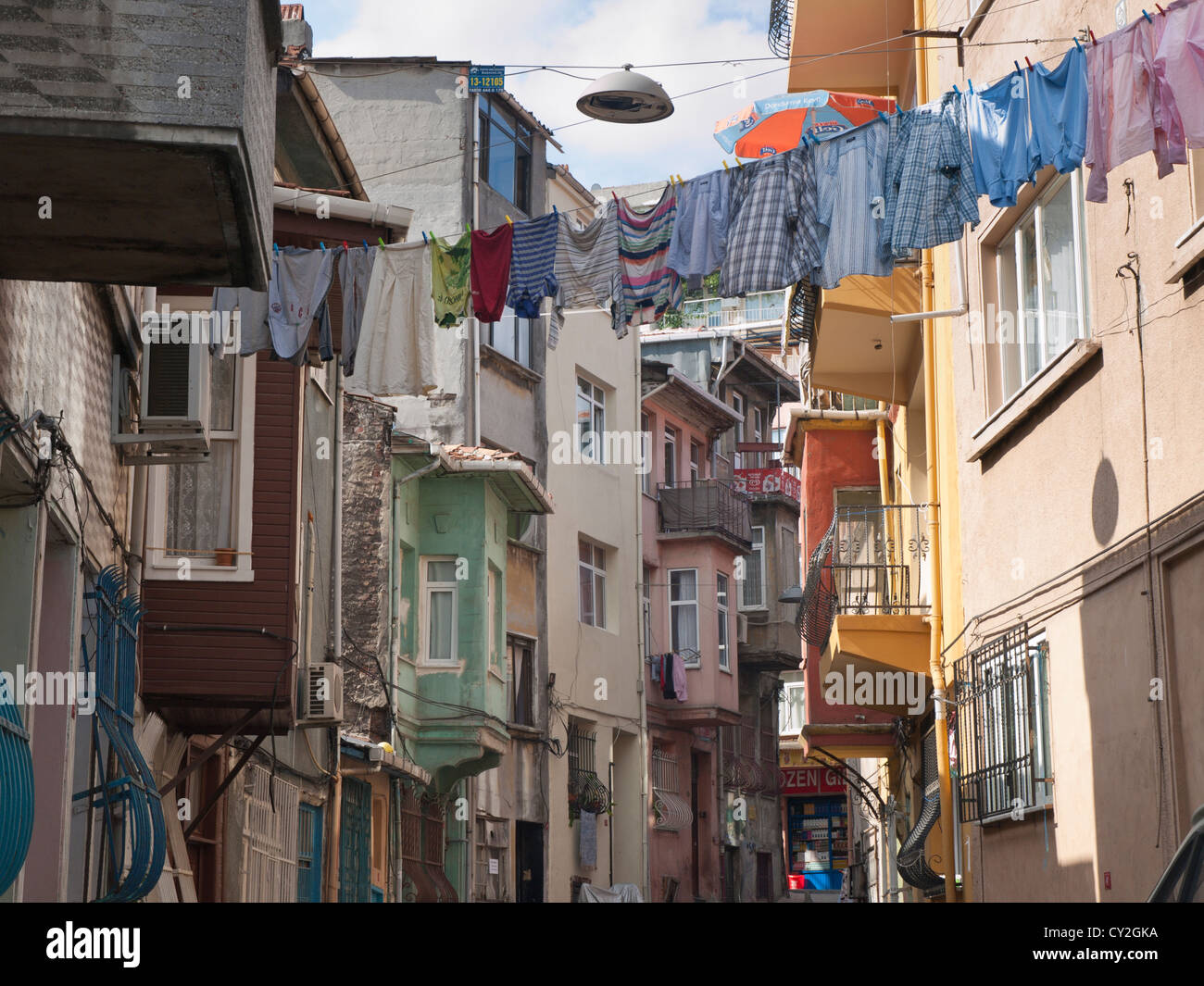 Clothes line, washing and  old houses in traditional Turkish style in the Balat, Istanbul Turkey Stock Photo