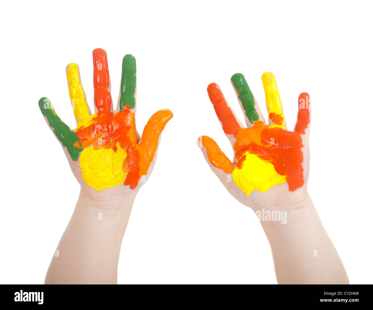 Kid's hands painted in bright colors isolated on white Stock Photo
