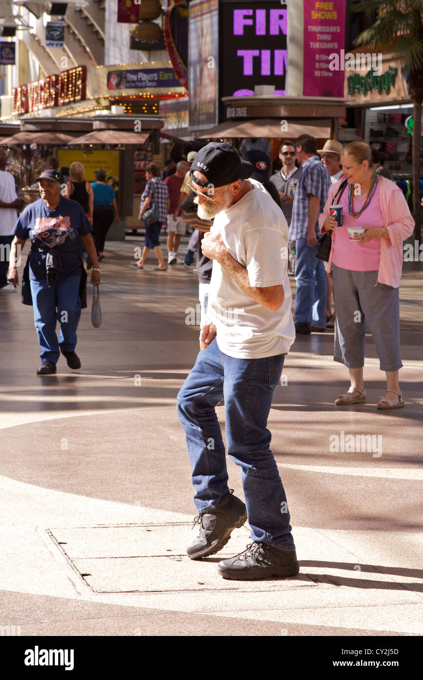 An impromptu karaoke show on Fremont Street with a passer by joining in