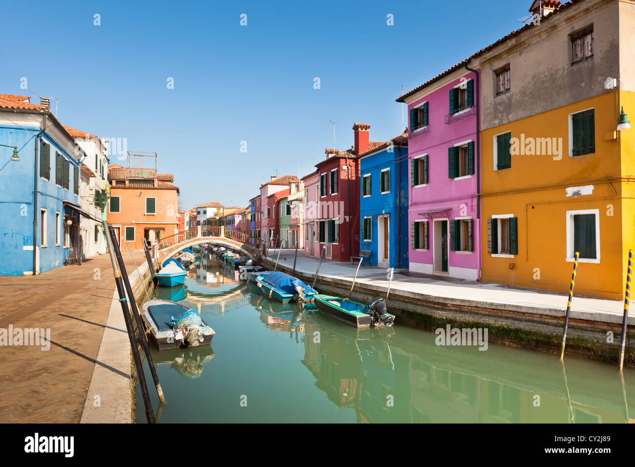 Colorful houses along canal in the island of Burano near Venice, Italy ...