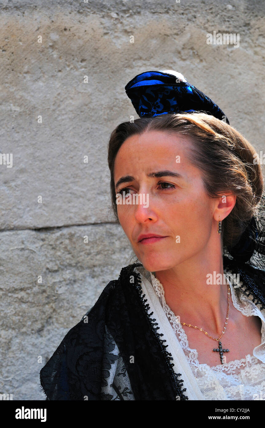Lady in traditional costume as is the derigger for Guardians wifes and Beauxs during the  Fete des Guardians in Arles Stock Photo