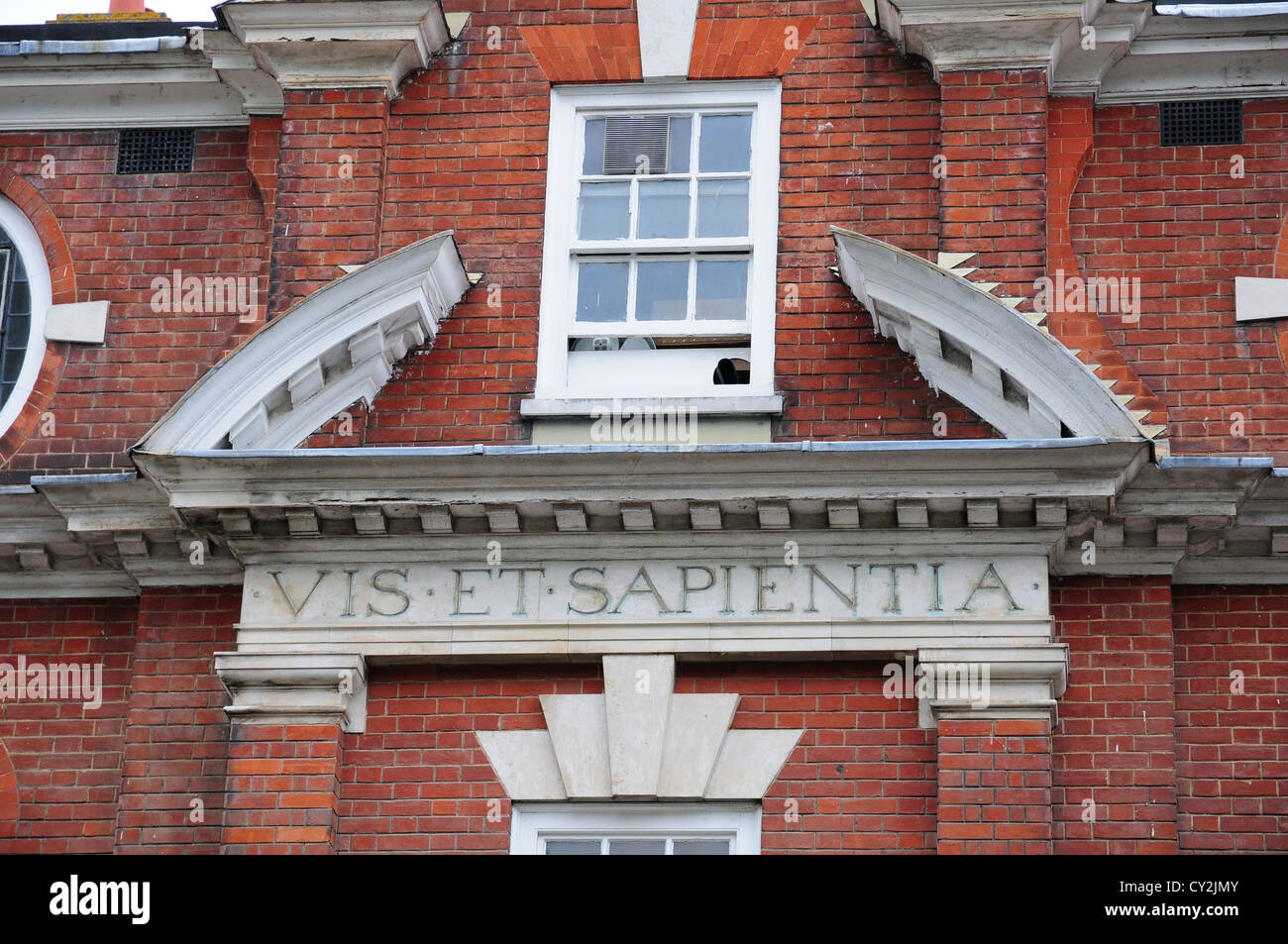 Oliver Whitby's motto above the door of what was the school he founded. Now Army and Navy Stores, Chichester Stock Photo