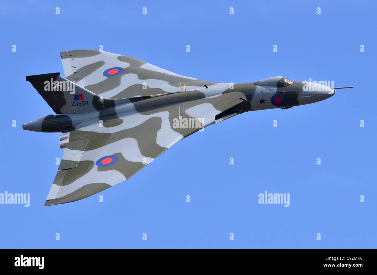 Avro Vulcan bomber aircraft in RAF camouflage displaying at Duxford Airshow. Vulcan B2 XH558 was the last flying V Bomber. Stock Photo