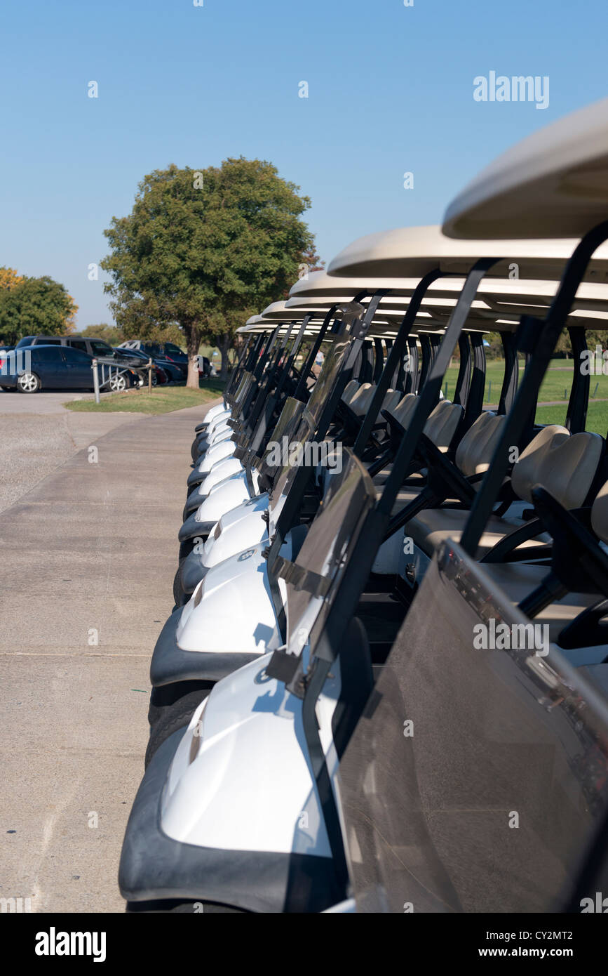 A row of golf carts wait for rental at a golf course in Oklahoma City, Oklahoma. Stock Photo