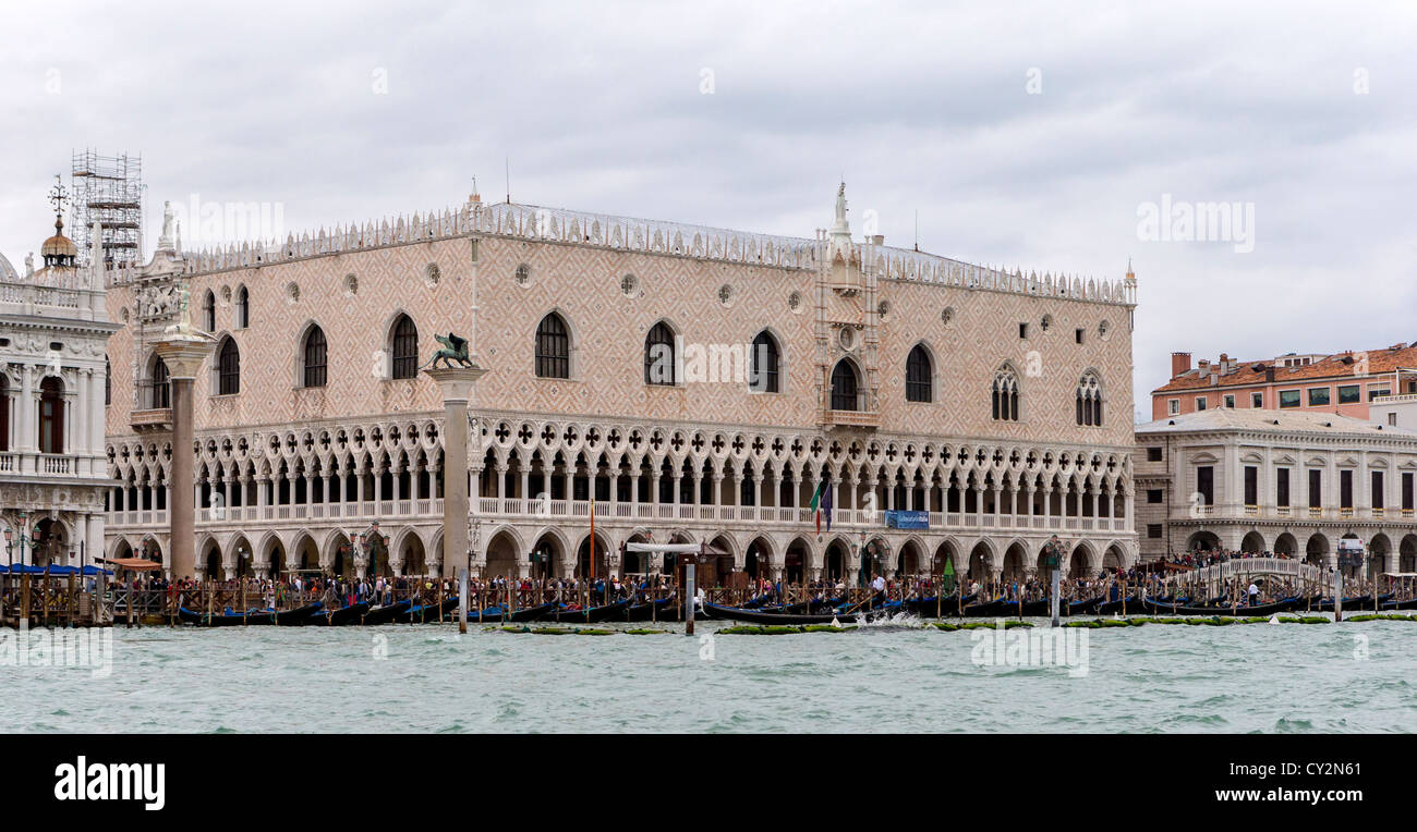 The Doge's Palace in Venice seen from the Canale Grande, with many gondolas moored in front of it Stock Photo