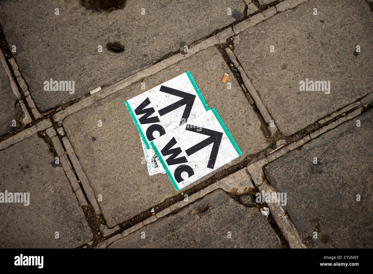 WC Stickers On The Pavement In Venice Giving Directions To The Nearest 