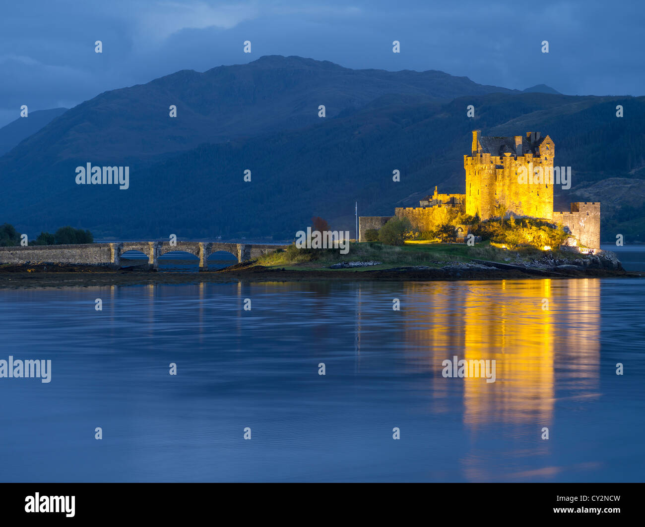View of Eilean Donan Castle lite up at twilight. Stock Photo
