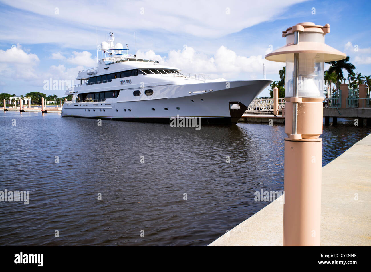 Palm Beach Harbor Marina with blue cloudy sky and a yacht in the background in West Palm Beach Florida Stock Photo