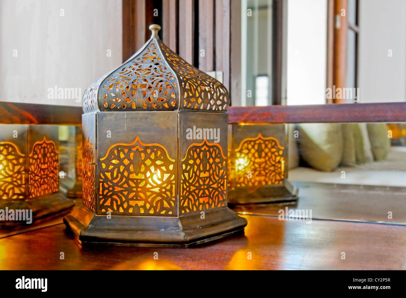 table lamp on a corner unit shaped like an oriental lantern with electric tungsten bulb. Generic image and interior detail Stock Photo