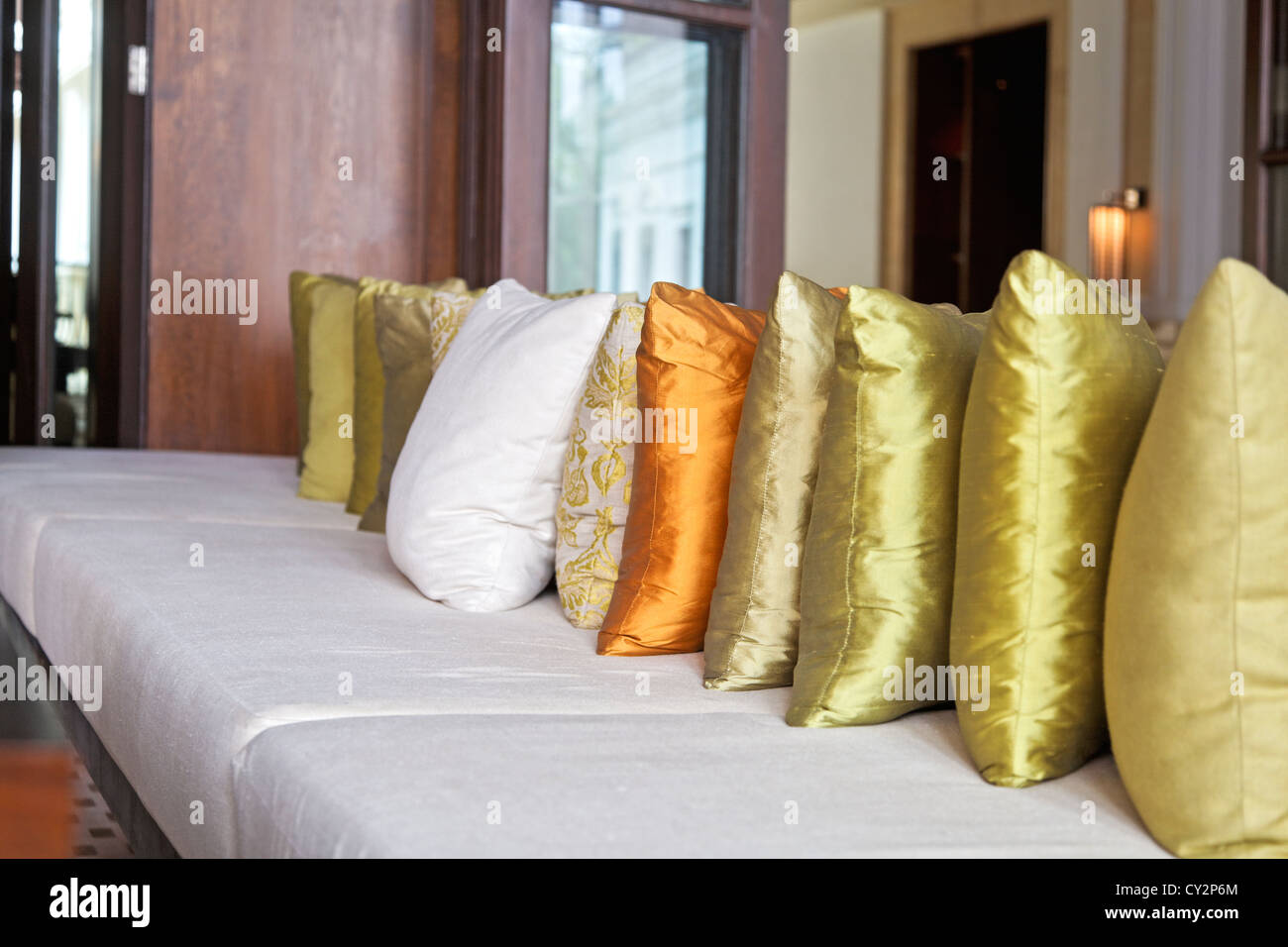 Interior detailing of bespoke lounge furniture with multi colored scatter cushions. Location of generic shot was India Stock Photo