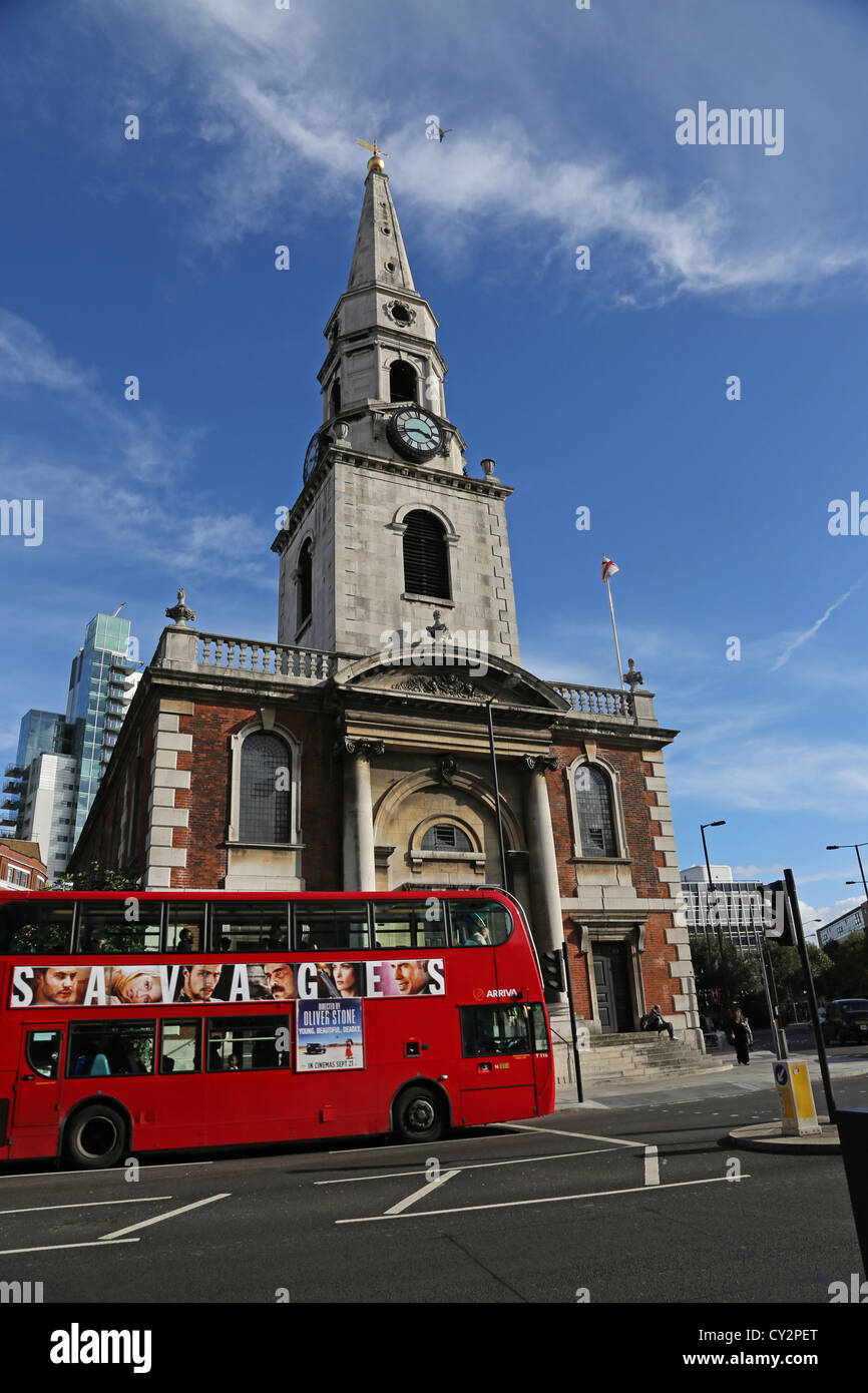 London England Borough Church Of Saint George The Martyr With Saint Jude Consecrated in 1736 Double Decker Bus At Traffic Lights Stock Photo