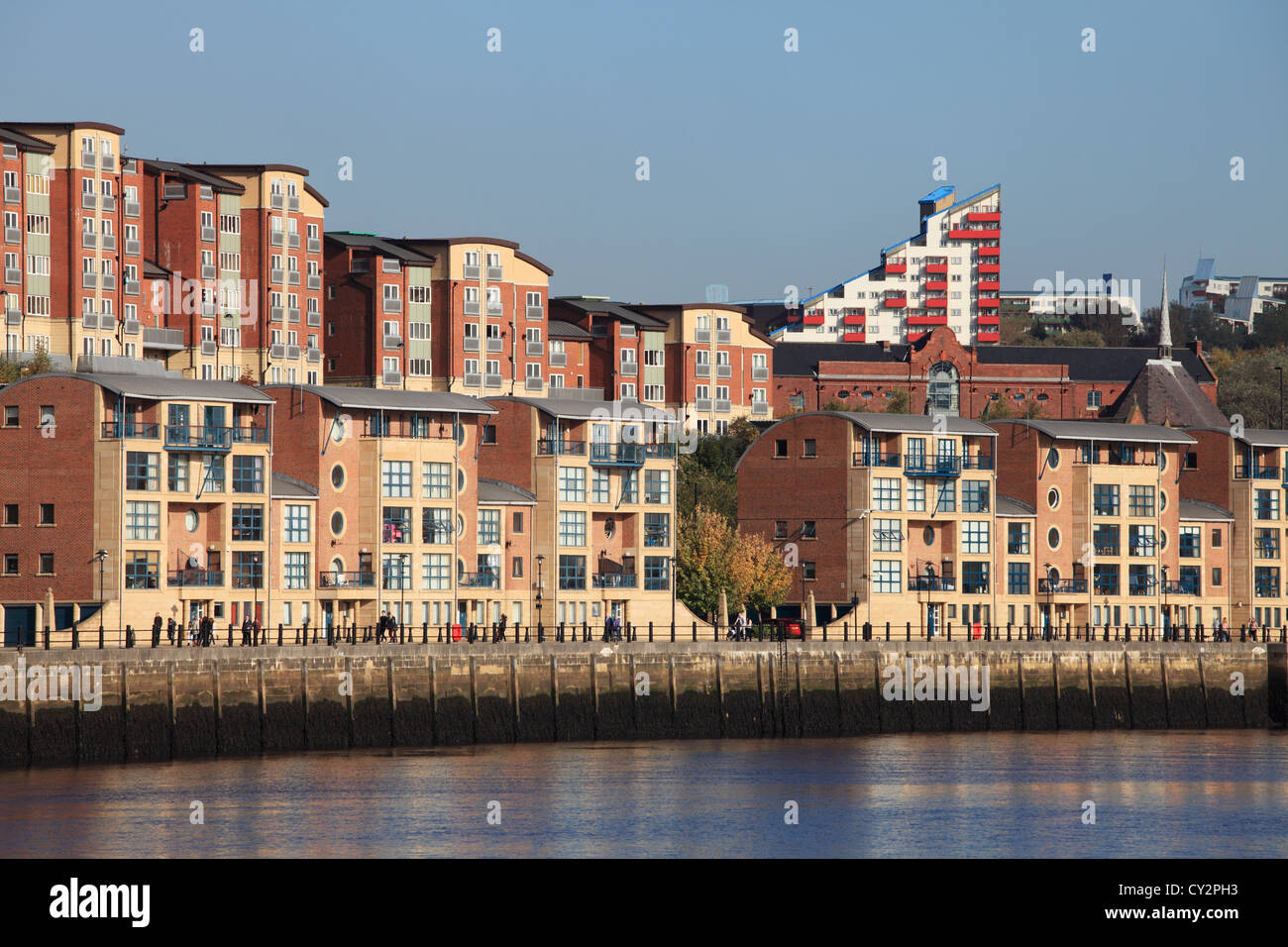 Riverside development on the north bank of the river Tyne at Newcastle, Byker Wall is visible in the background. Stock Photo
