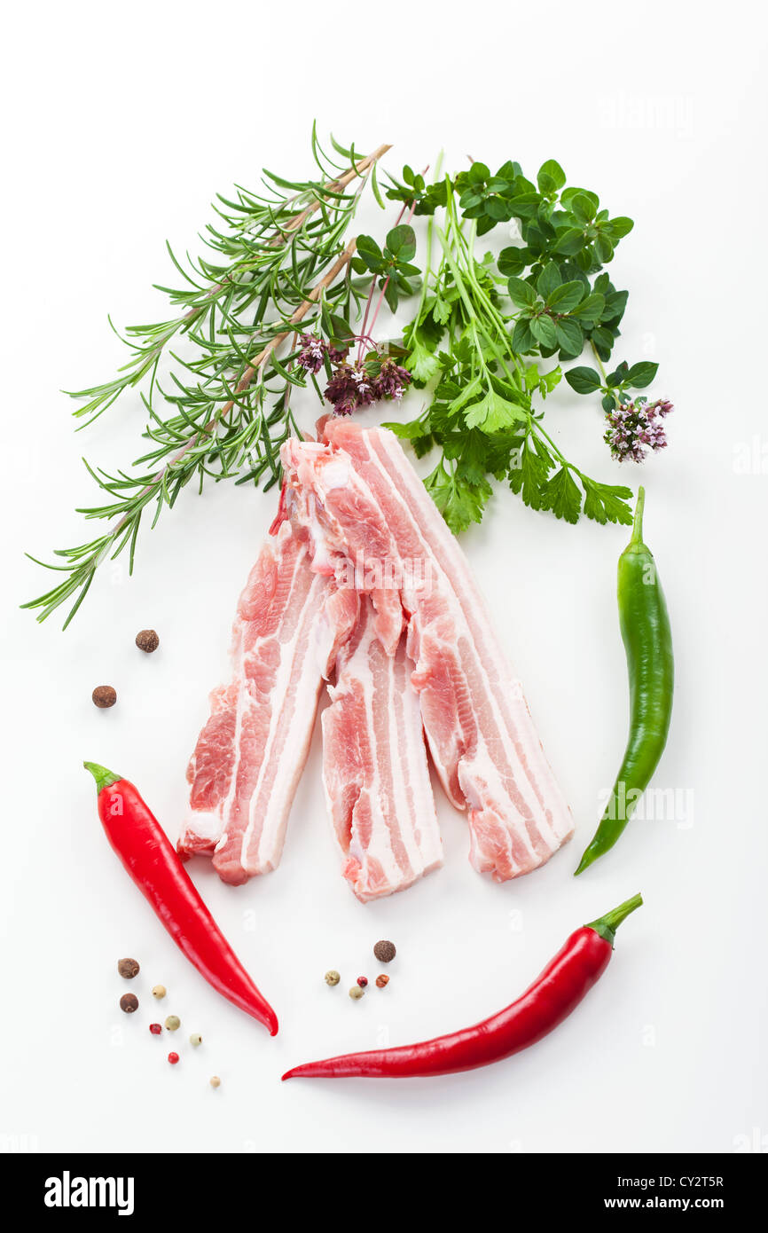 Raw bacon with rosemary on white background Stock Photo - Alamy
