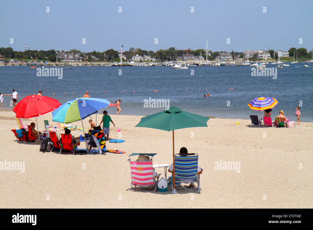 Cape Cod Massachusetts,Hyannis,Lewis Bay,Kalmus Beach Park,sand,boats,sunbathers,umbrella,MA120817054 Stock Photo