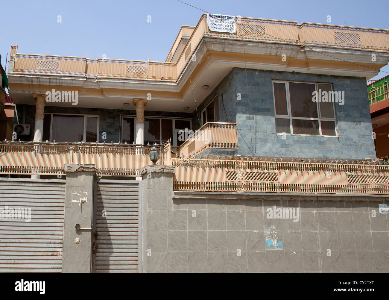 poppy palaces, build from drug money in Afghanistan. Foreigners are leaving afghanistan and most houses are vacant. Stock Photo