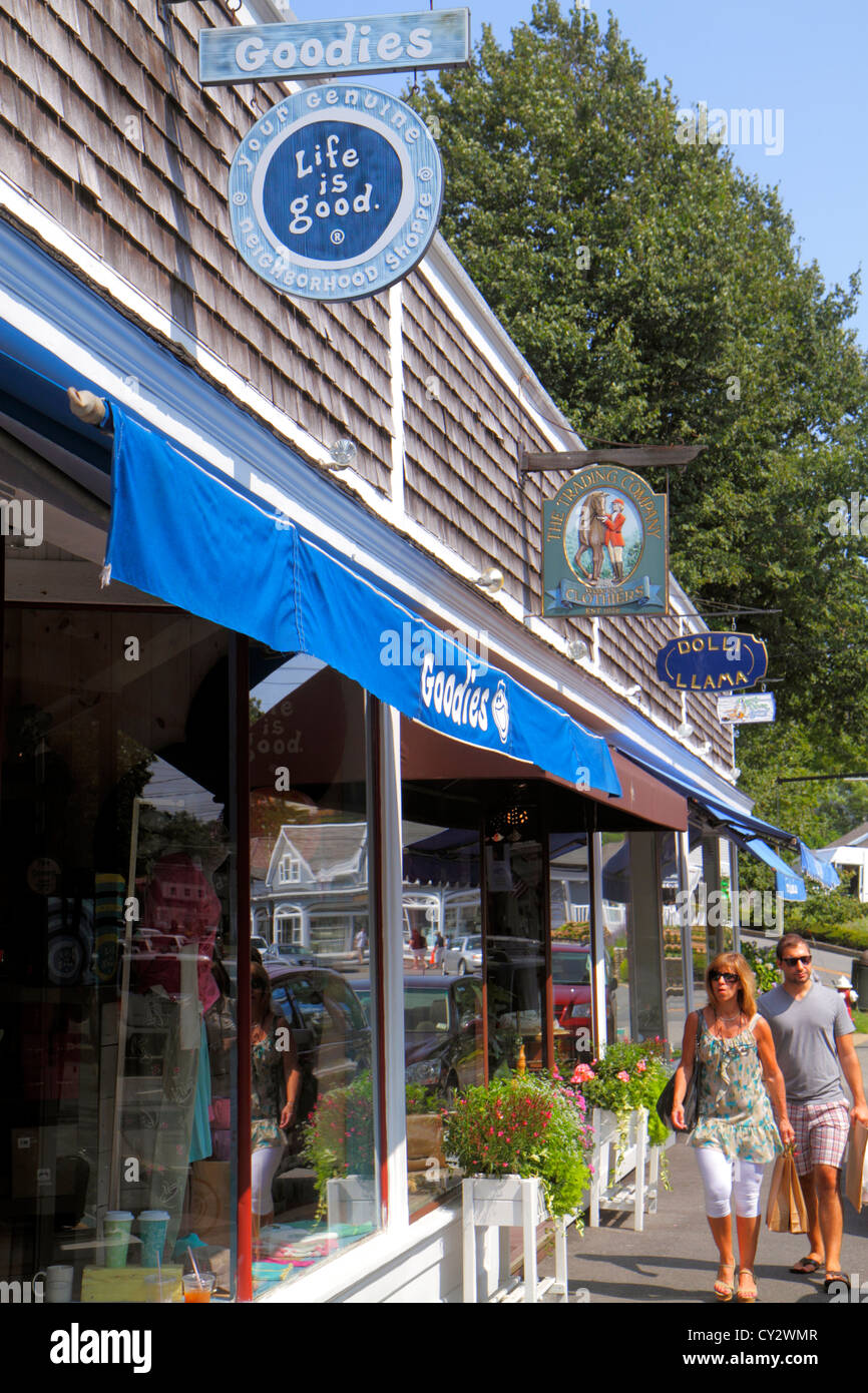 Cape Cod Massachusetts,Chatham,Main Street,woman female women,man men male,couple,bags,shops,stores,shopping shopper shoppers shop shops market market Stock Photo