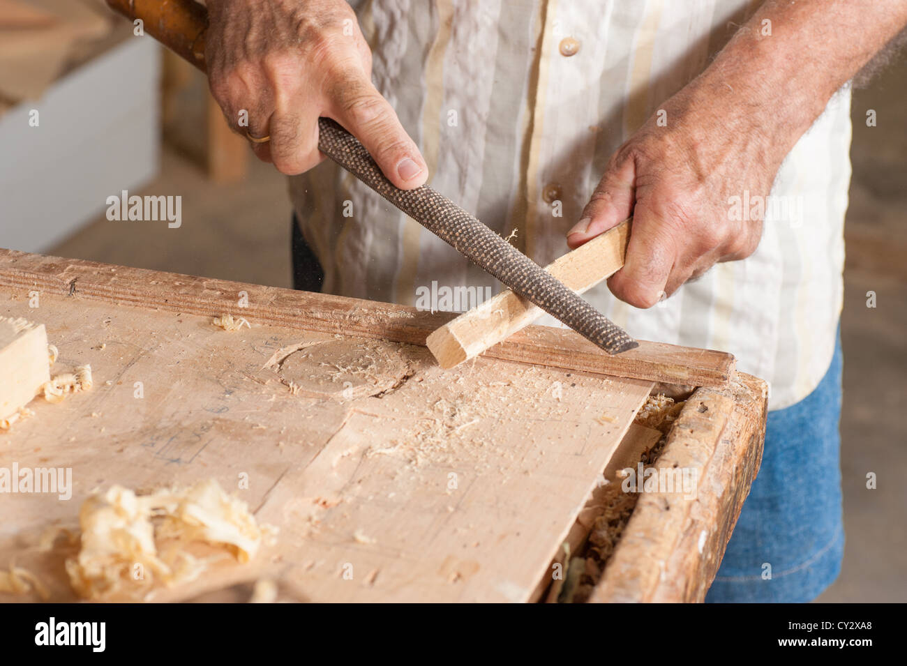 A rasp in the rugged hands of a skilled carpenter Stock Photo Alamy