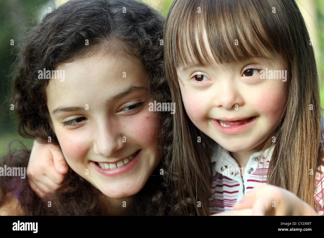 Portrait of beautiful young girls in the park Stock Photo - Alamy