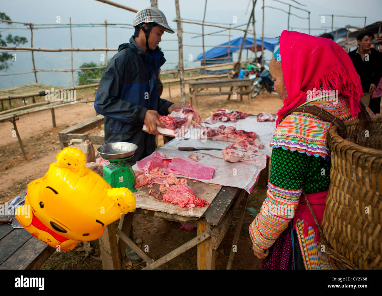 Flower Hmong Woman Buying Meat In Sapa Market, Vietnam Stock Photo