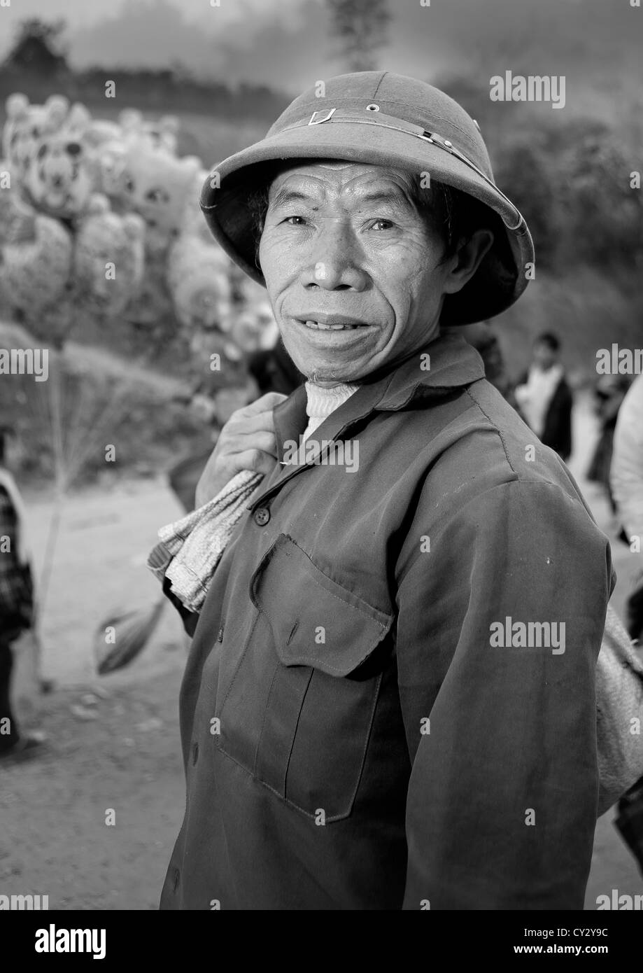 Man With A Colonial Hat On A Market Place, Sapa, Vietnam  Stock Photo