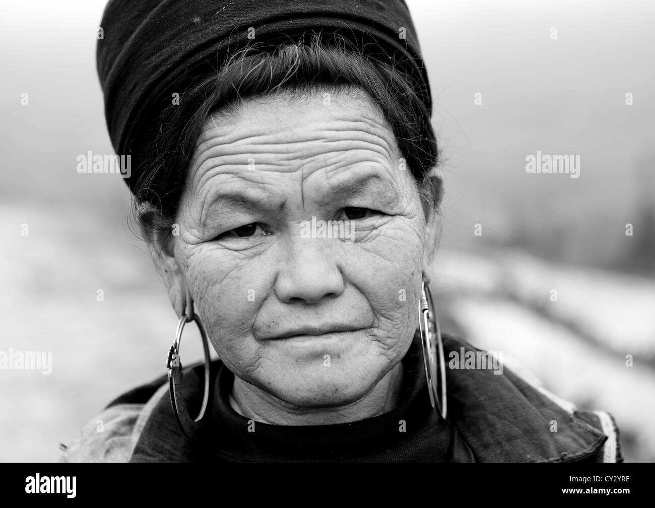 Black Hmong Woman With Traditional Hat And Earrings, Sapa, Vietnam Stock Photo
