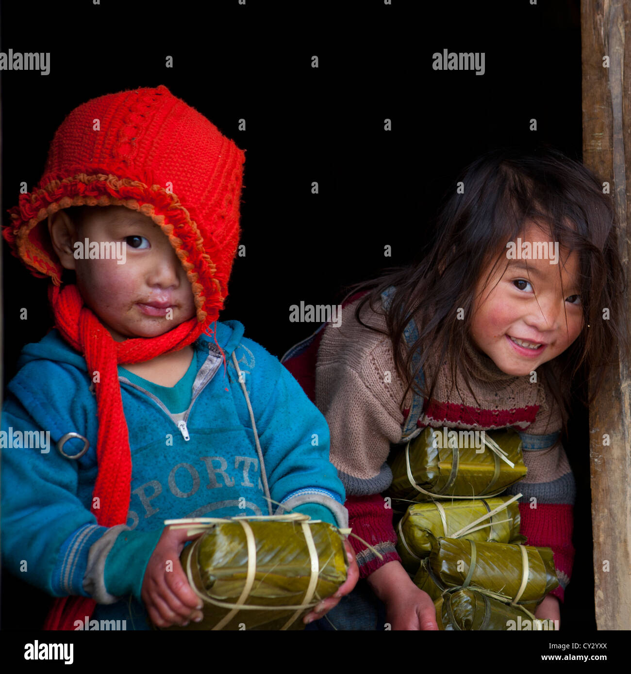 Hmong Wrapped Rice Black Hmong Kids Holding Wrapped Rice Cakes For Tet, Sapa, Vietnam ...