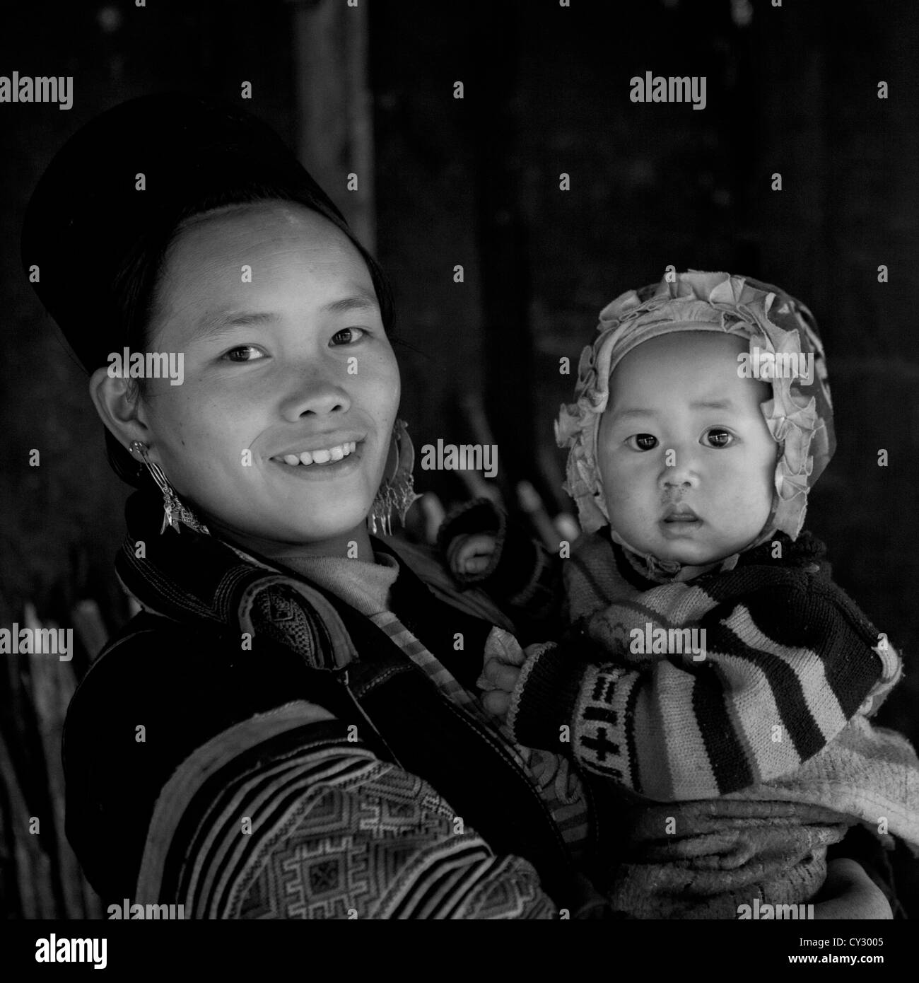 Black Hmong Mother And Baby In Traditional Clothes, Sapa, Vietnam Stock Photo
