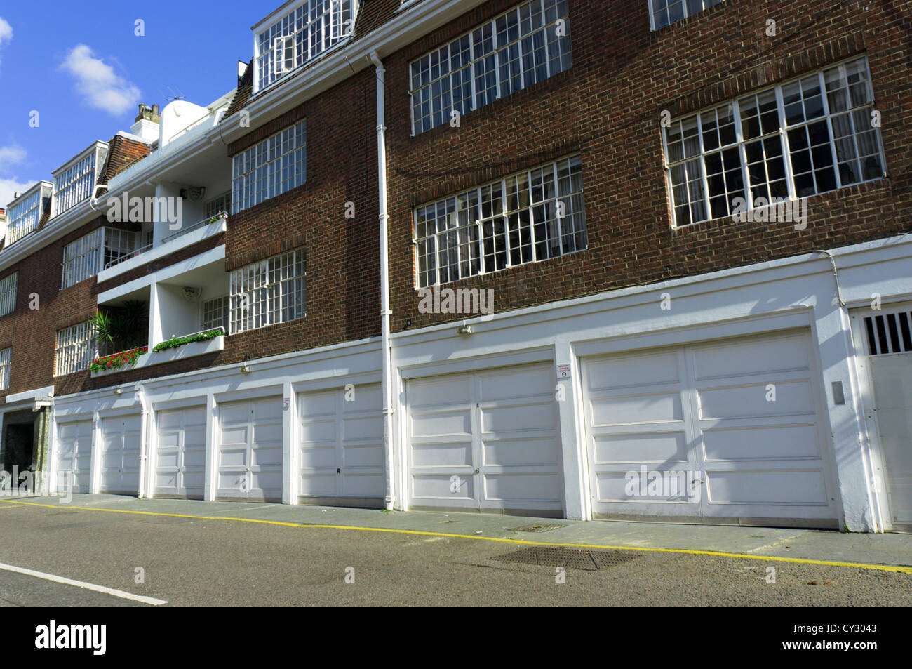 Homes with integrated garages in Cadogan Lane, Belgravia, London. Stock Photo