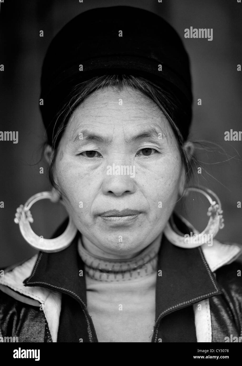 Black Hmong Woman With Traditional Headgear And Earrings, Sapa, Vietnam Stock Photo