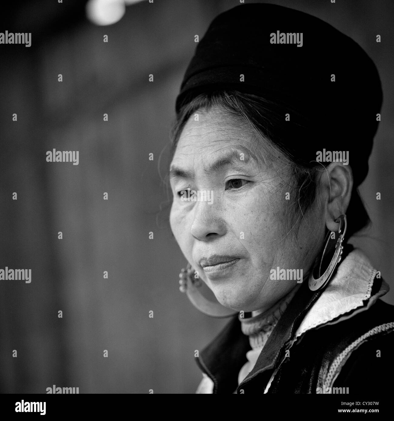 Black Hmong Woman With Traditional Headgear And Earrings, Sapa, Vietnam Stock Photo
