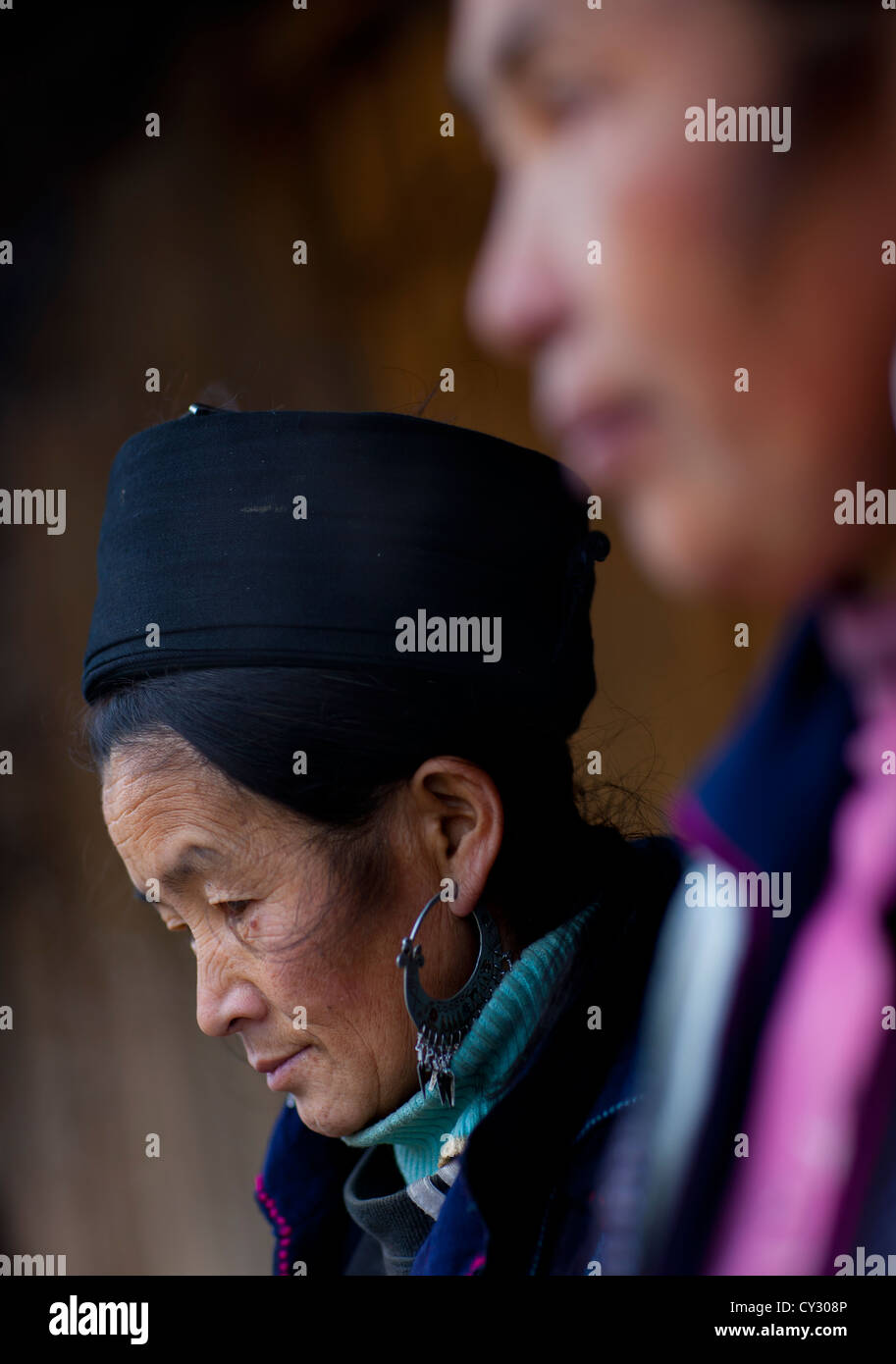 Black Hmong Woman With Traditional Hat And Earrings, Sapa, Vietnam Stock Photo