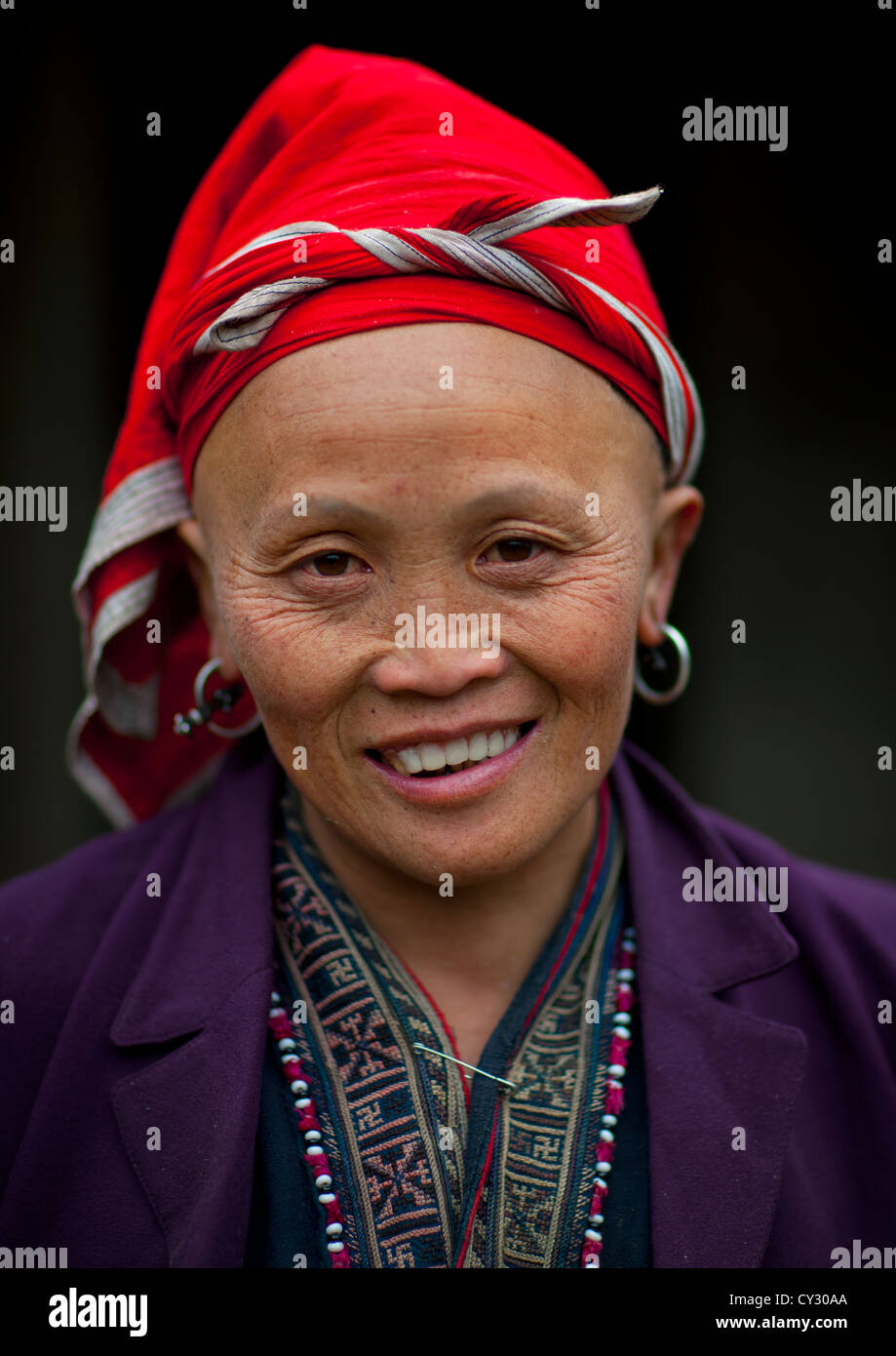 Old Red Dzao Woman With A Red Headscarf, Sapa, Vietnam Stock Photo