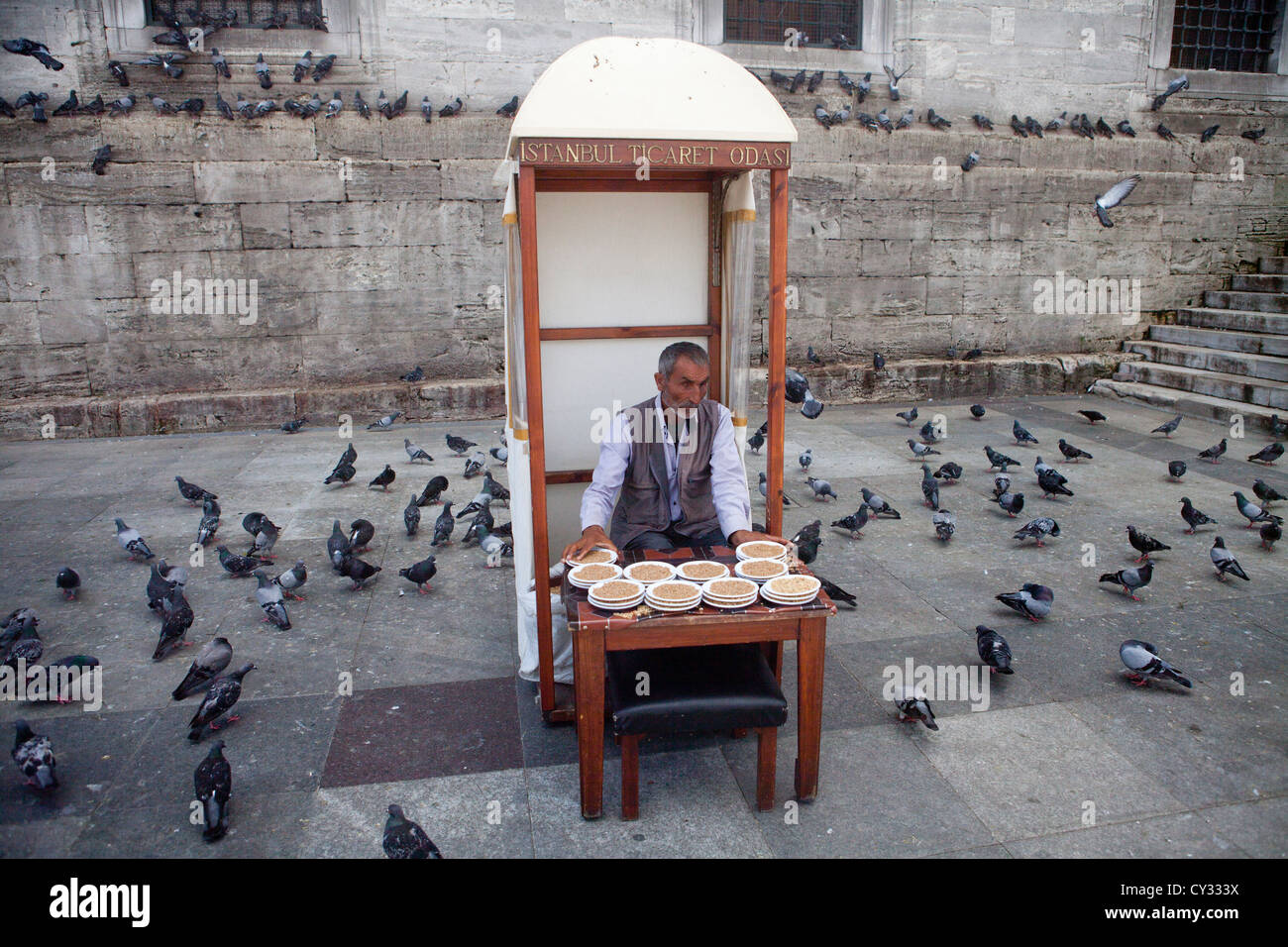 blind man selling food for pigeons, islamabad Stock Photo
