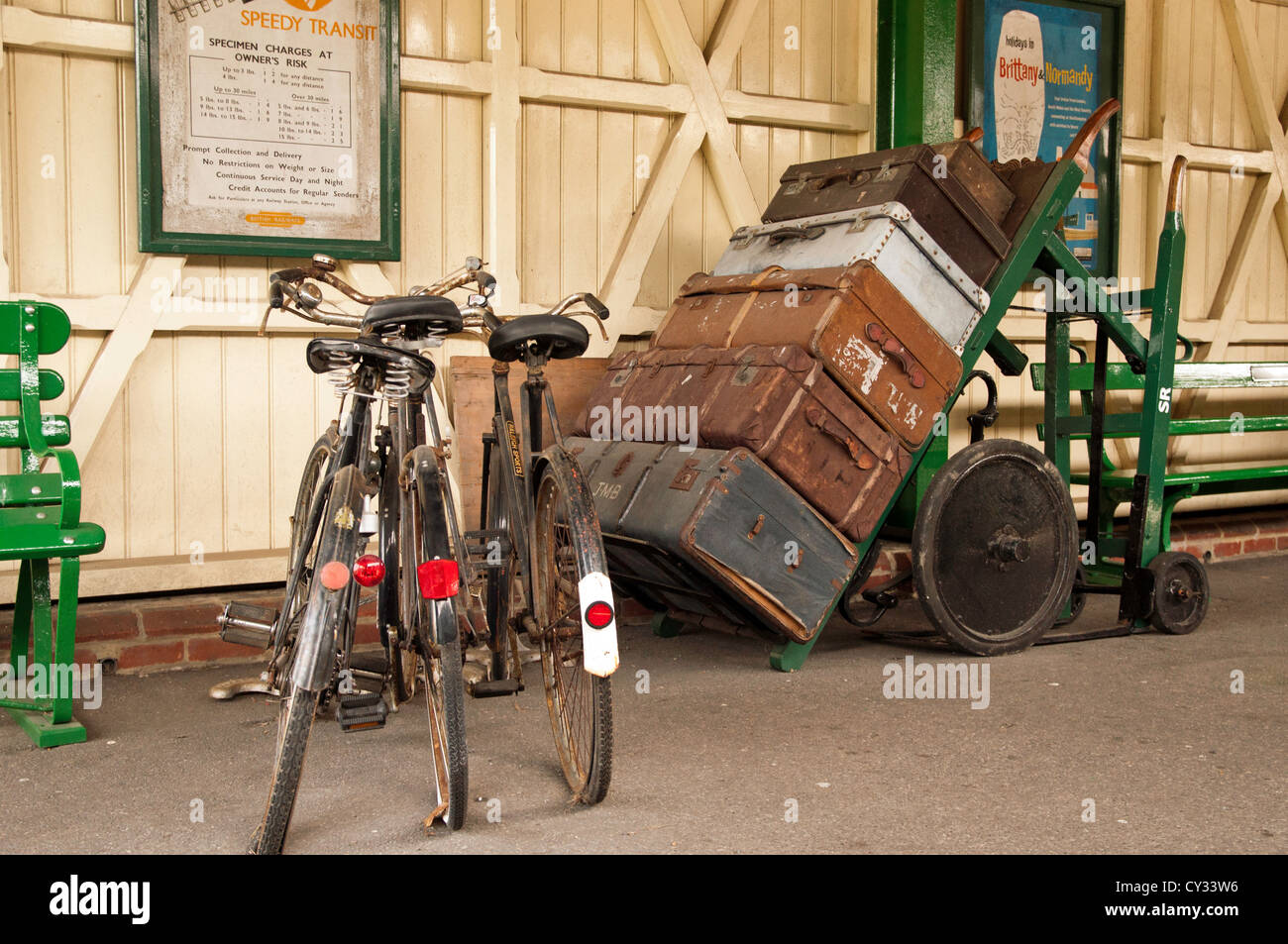 Left luggage on platform with Bicycles and trolly Stock Photo