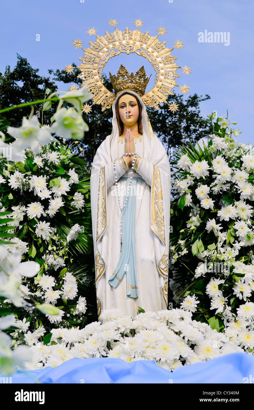 Mother mary statue crown flowers hi-res stock photography and ...