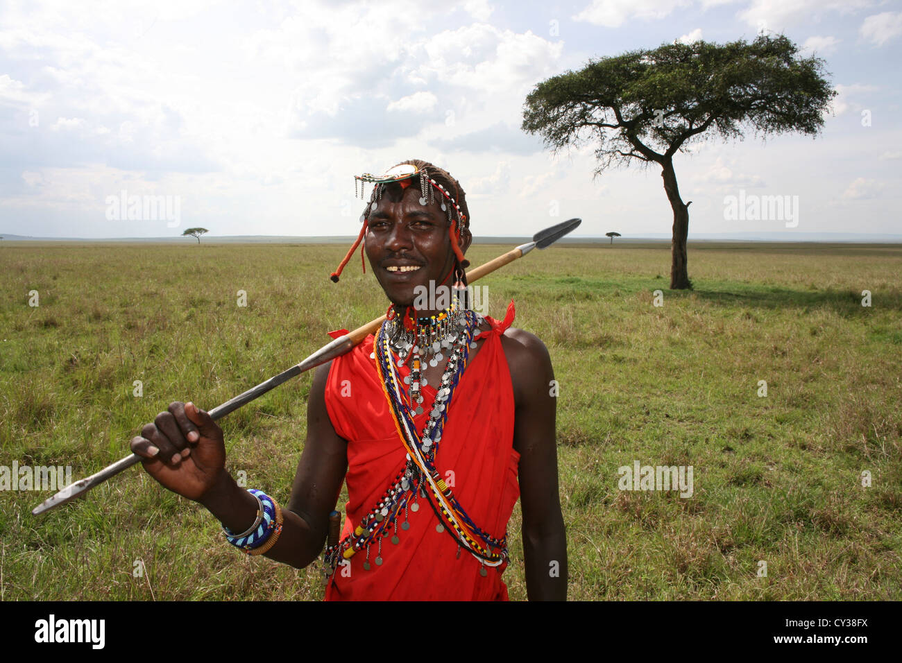 Male Maasai in traditional Shuka clothing with spear, Tsavo West