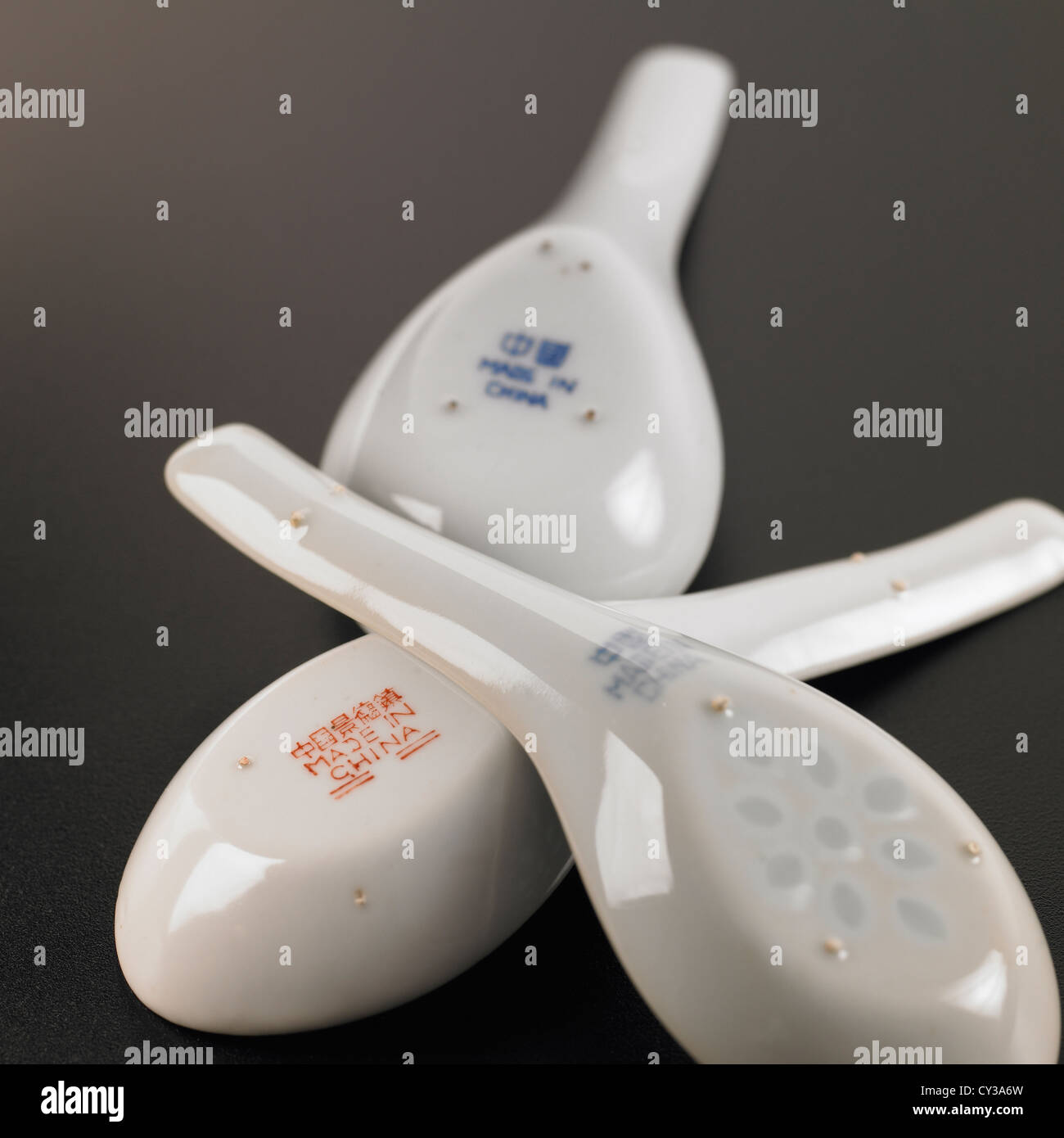 Made in China mark on base of upturned Chinese soup spoons Stock Photo