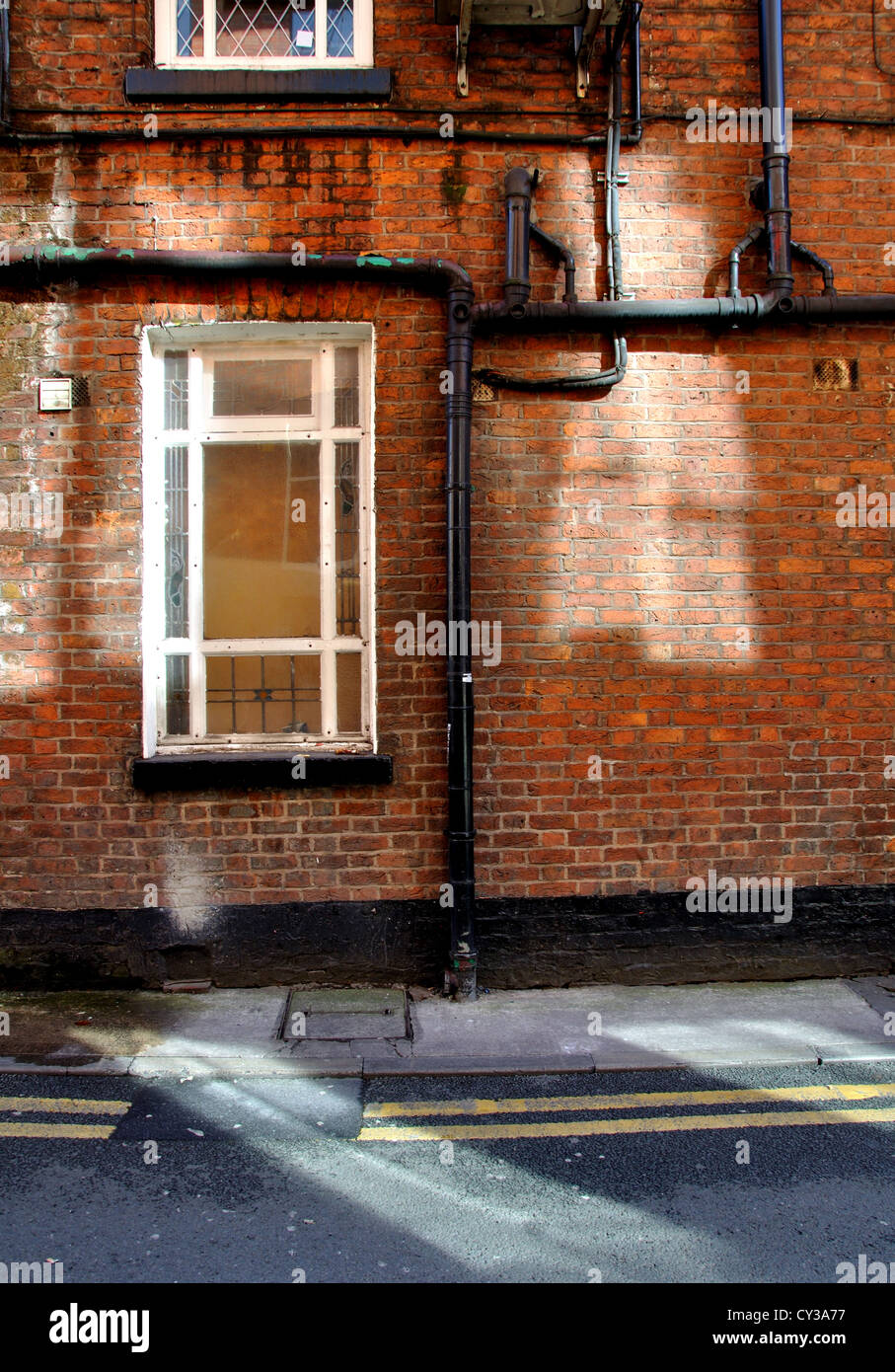 Facade of a small old factory in Manchester. UK, Great Britain. Stock Photo