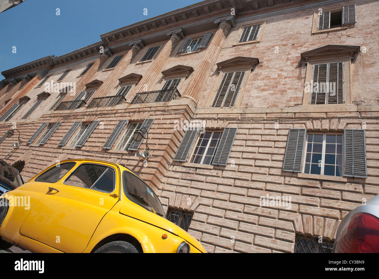 Umbria, Italy, yellow Fiat bambina in street. Stock Photo